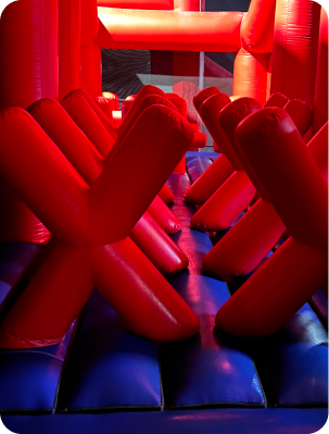 Inflatable obstacle course with red barriers