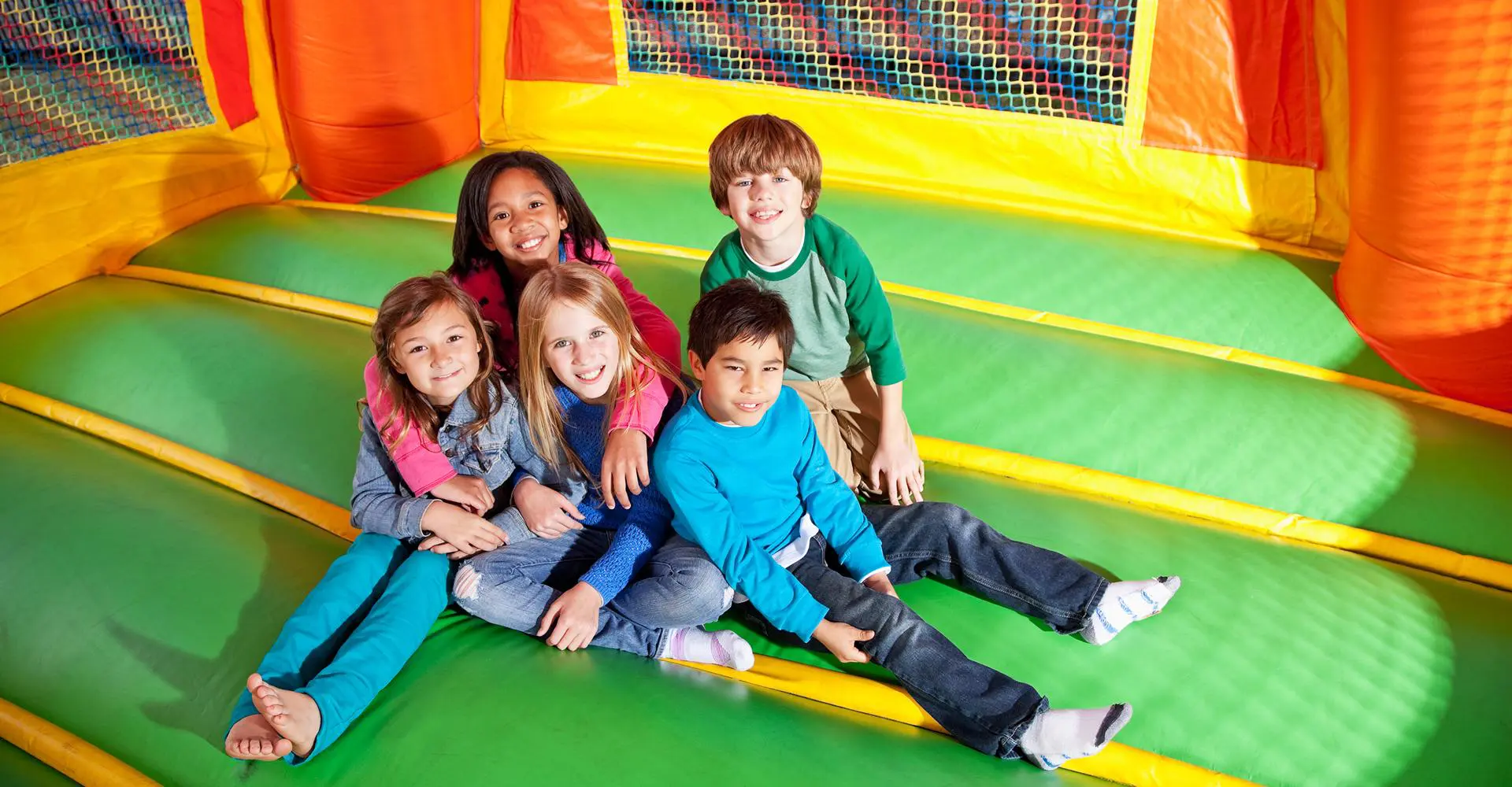 Kids playing in colorful bounce house